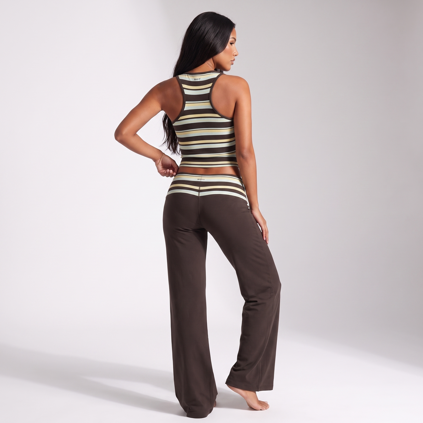 Back view showing the racerback tank and full-length trousers