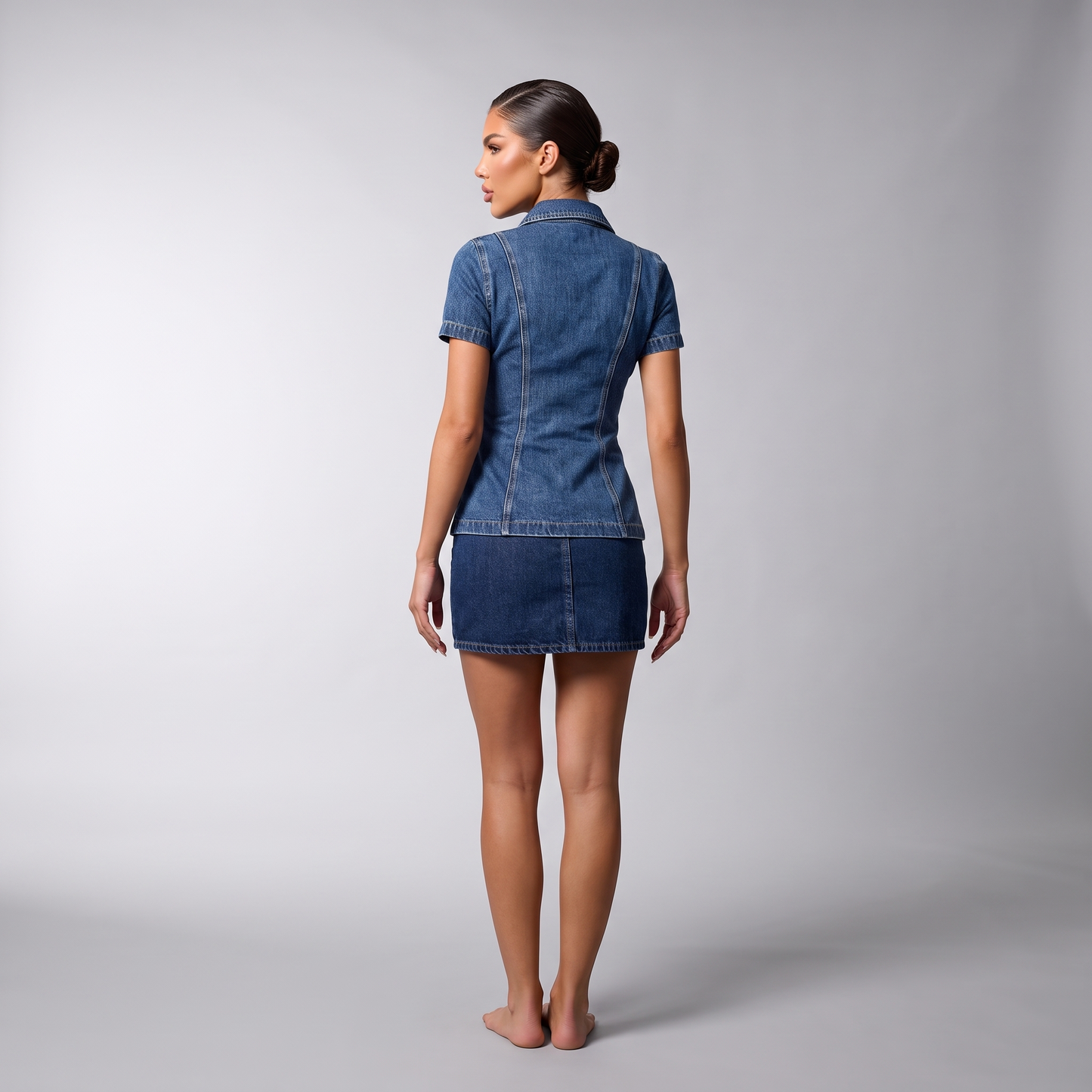 Back view of the denim shirt and mini skirt set showing the plain back panel and princess seams