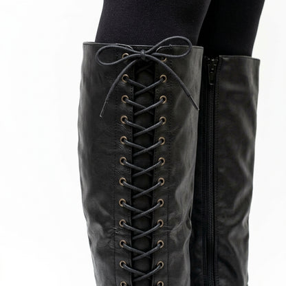 Black boots, close-up of the side lacing and zip