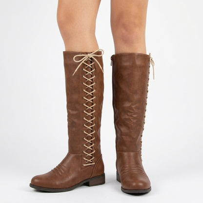 Brown knee-high lace-up boots, three-quarter view