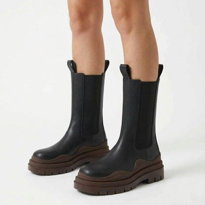 Black boots with brown sole, three-quarter view