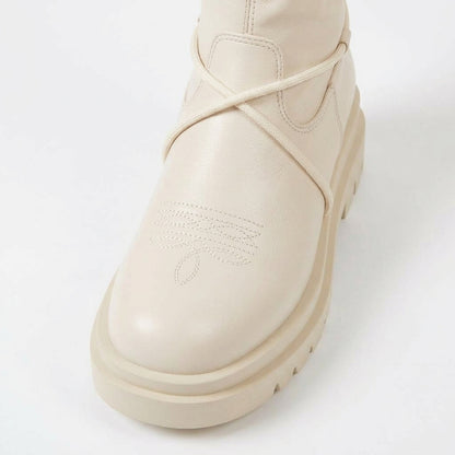 White boots, cord lacing detail