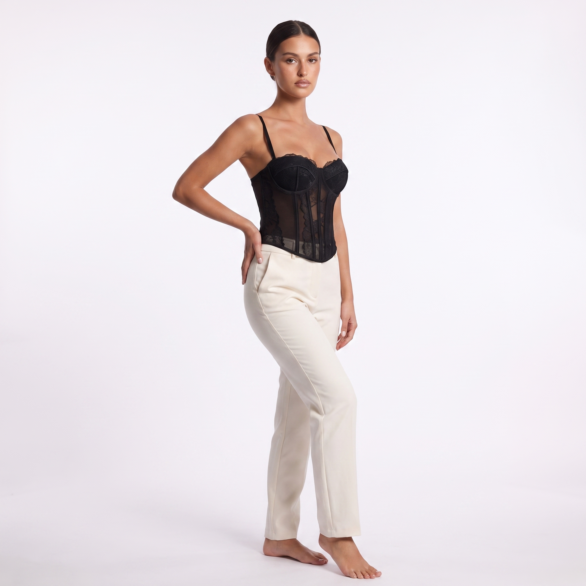 Womens lace corset top in black, three-quarter front studio view