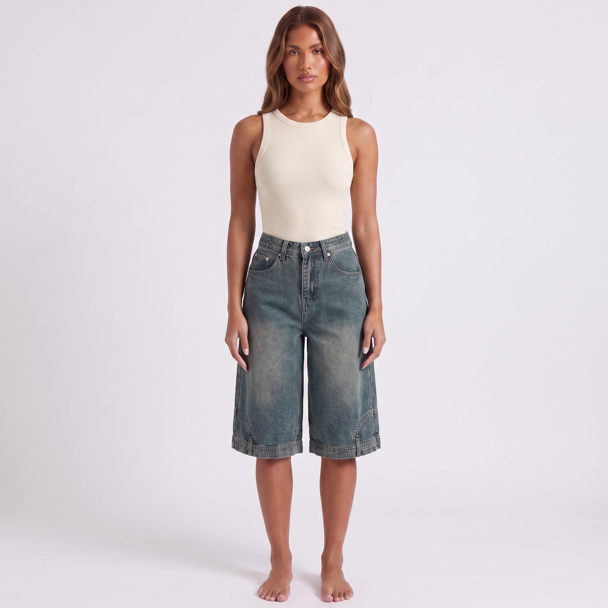 Retro high waist wide-leg knee-length denim shorts in washed blue-grey indigo - full length front view on model, hem falling just below the knee