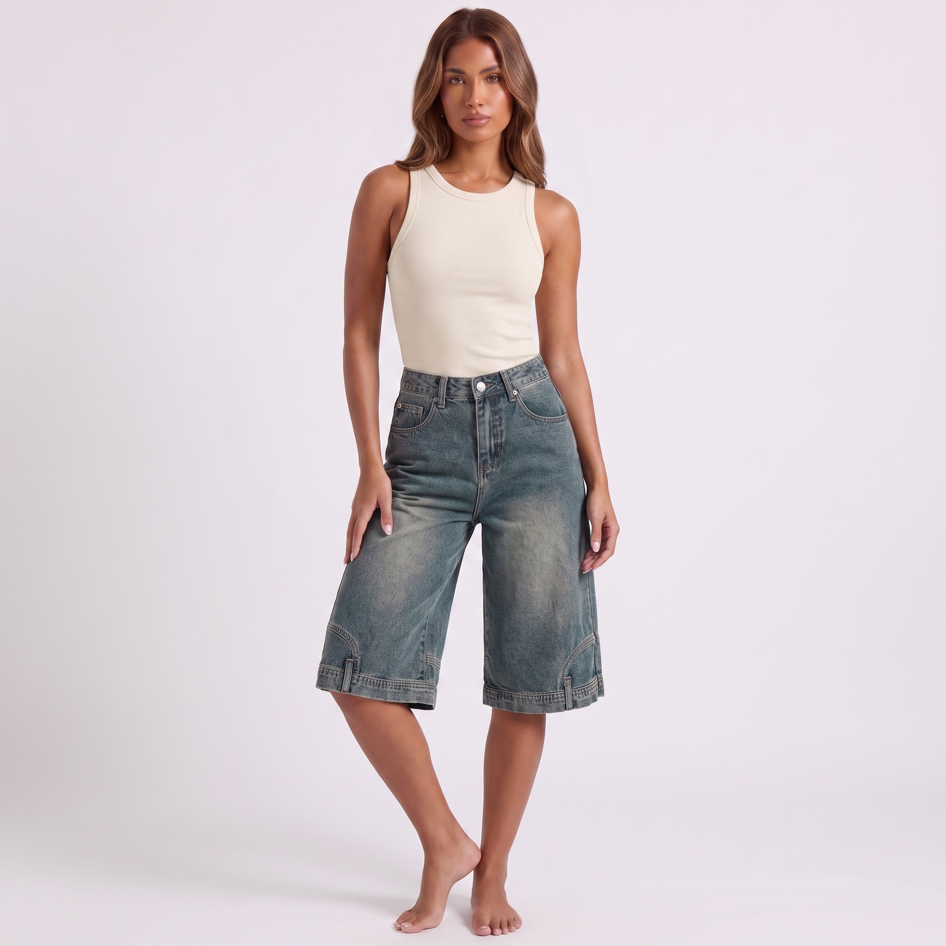 Retro high waist wide-leg knee-length denim shorts in washed blue-grey indigo - three-quarter angle showing the width and drape of the leg