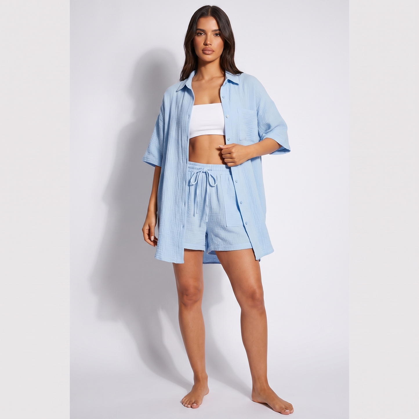 Maeve women's two-piece shorts set in light blue - oversized longline open shirt over bandeau with drawstring shorts, full look
