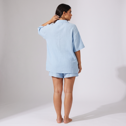 Maeve light blue shorts set back view of the oversized longline shirt