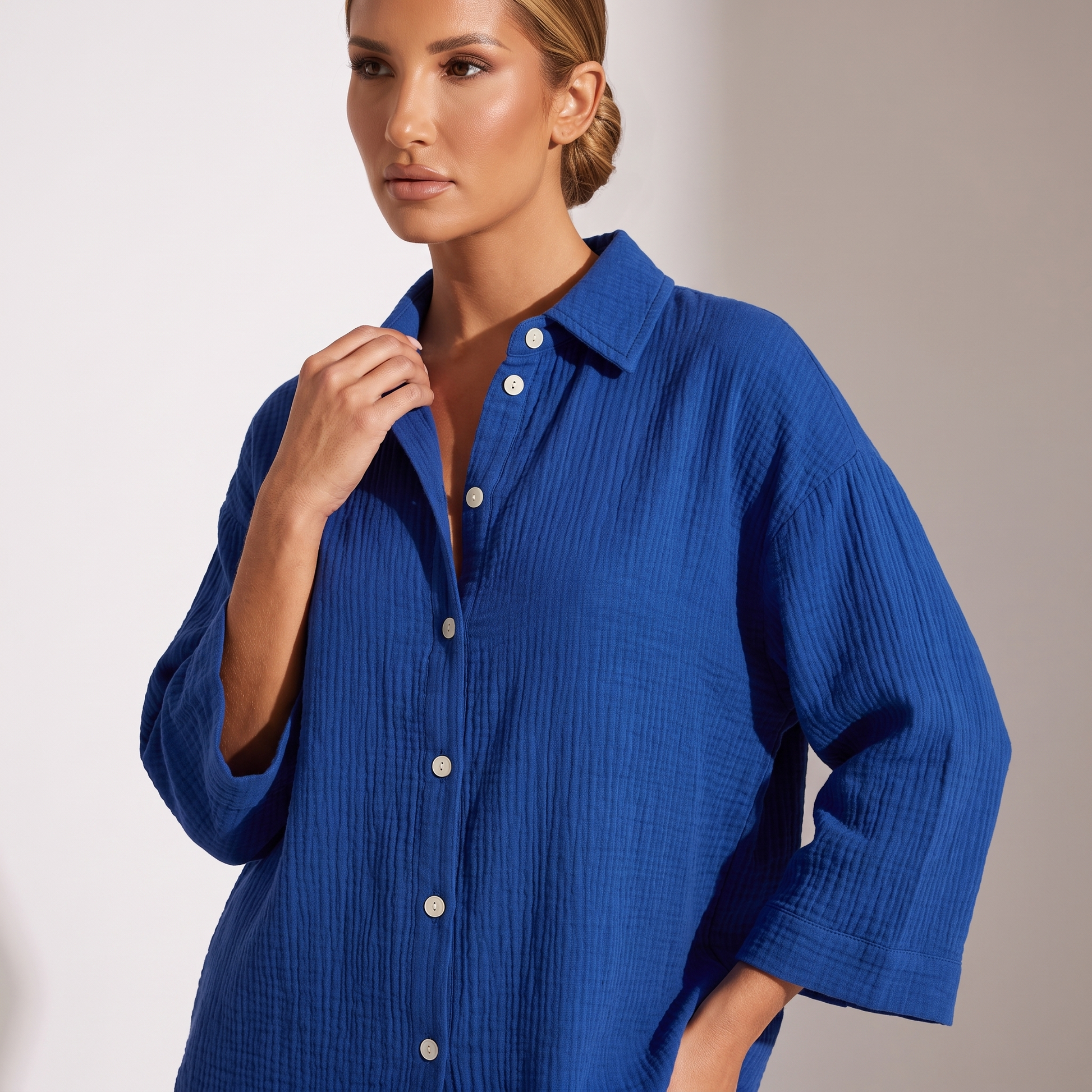 Detail of the oversized cotton gauze shirt with point collar and button placket in Dark Blue