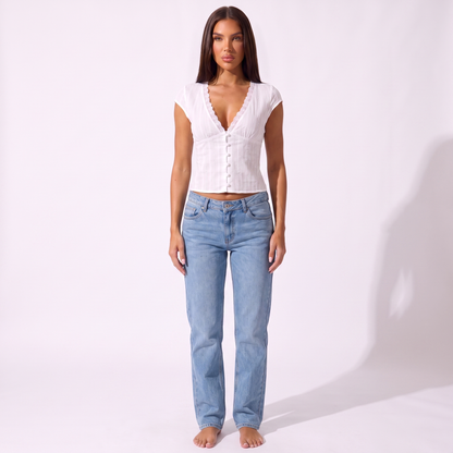Women's V-Neck Embroidered Blouse in white, full-length model view styled with light-wash jeans