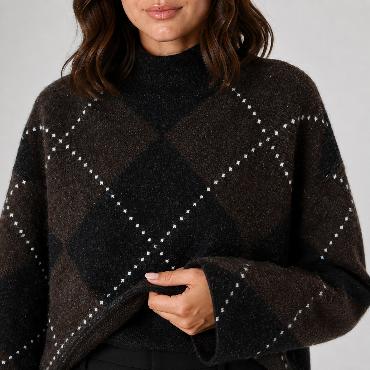 Brown and black argyle top detail view