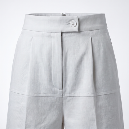 White high-waist tailored linen shorts – waistband, hook-and-bar and fly detail