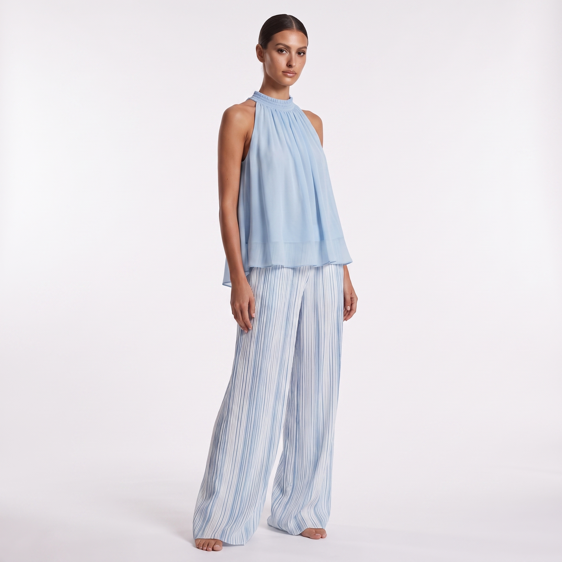 Sky blue chiffon top and striped trousers set, three-quarter view