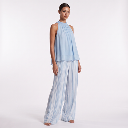 Sky blue chiffon top and striped trousers set, three-quarter view