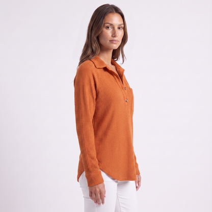 Three-quarter view, raglan sleeve and curved hem