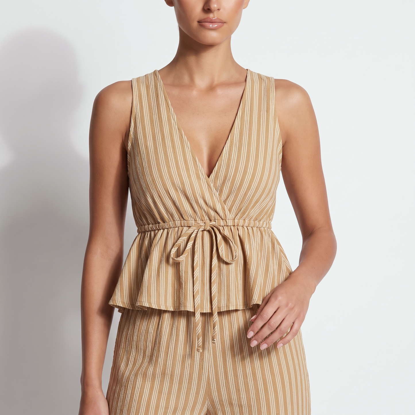 Khaki striped surplice V-neck top with drawstring waist bow and peplum ruffle, detail