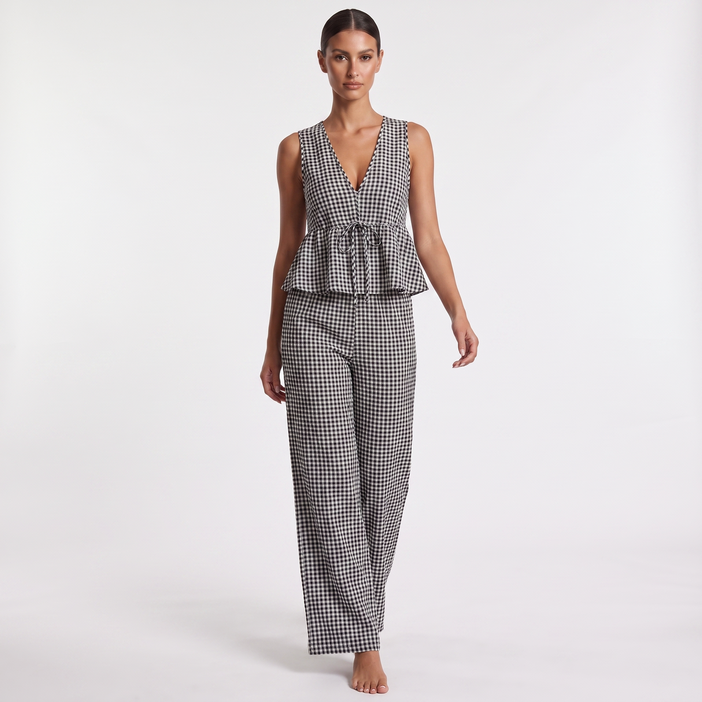Black and white gingham check sleeveless V-neck peplum top and wide-leg trouser set, full-length front view