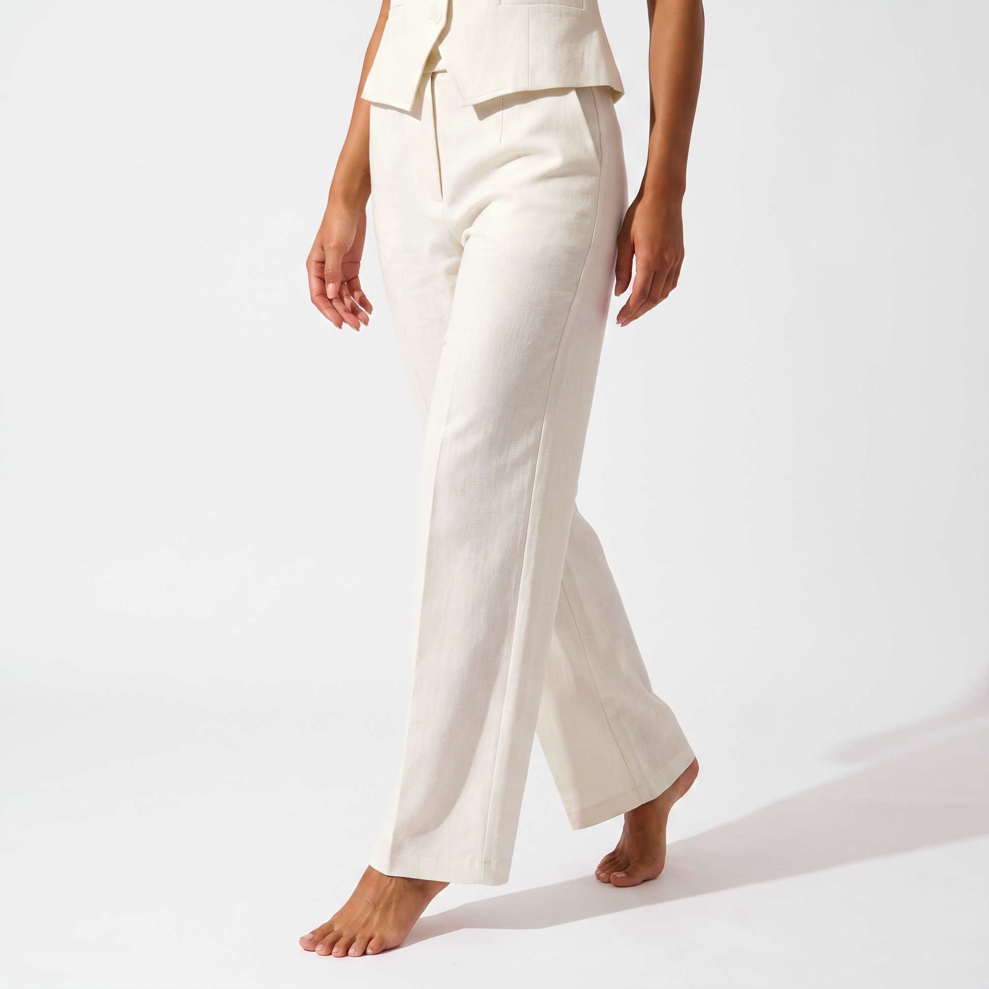 White high-waisted wide-leg tailored trousers, full-length detail