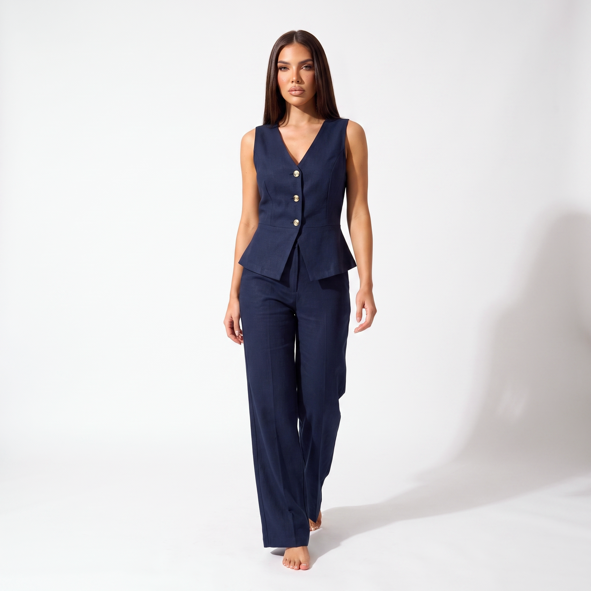 Navy sleeveless V-neck peplum vest and high-waisted wide-leg trouser set, full-length front view